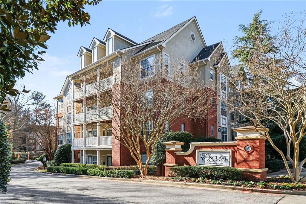 1319 Westchester Ridge Northeast Atlanta, GA 30329 - Photo 3 of 42 front view of a building with a street