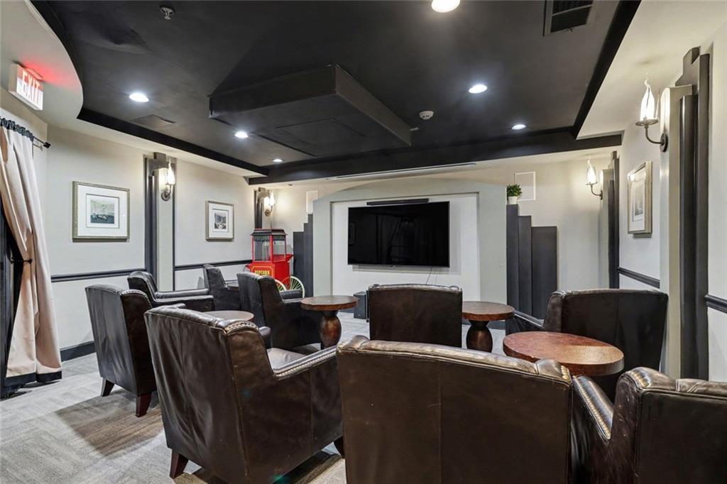 1319 Westchester Ridge Northeast Atlanta, GA 30329 - Photo 31 of 42 a living room with furniture and a flat screen tv