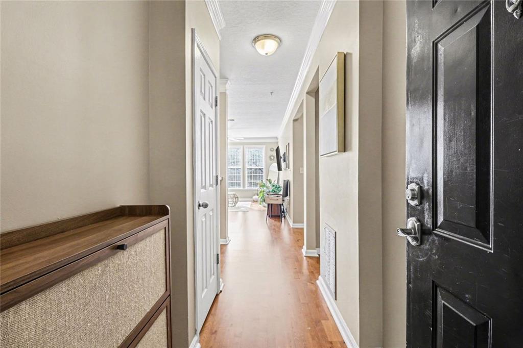 1319 Westchester Ridge Northeast Atlanta, GA 30329 - Photo 7 of 42 a view of a hallway with wooden floor and staircase