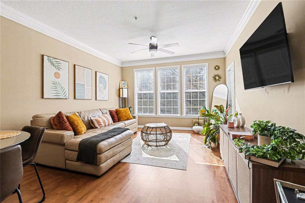 1319 Westchester Ridge Northeast Atlanta, GA 30329 - Photo 9 of 42 a living room with furniture potted plant and a flat screen tv