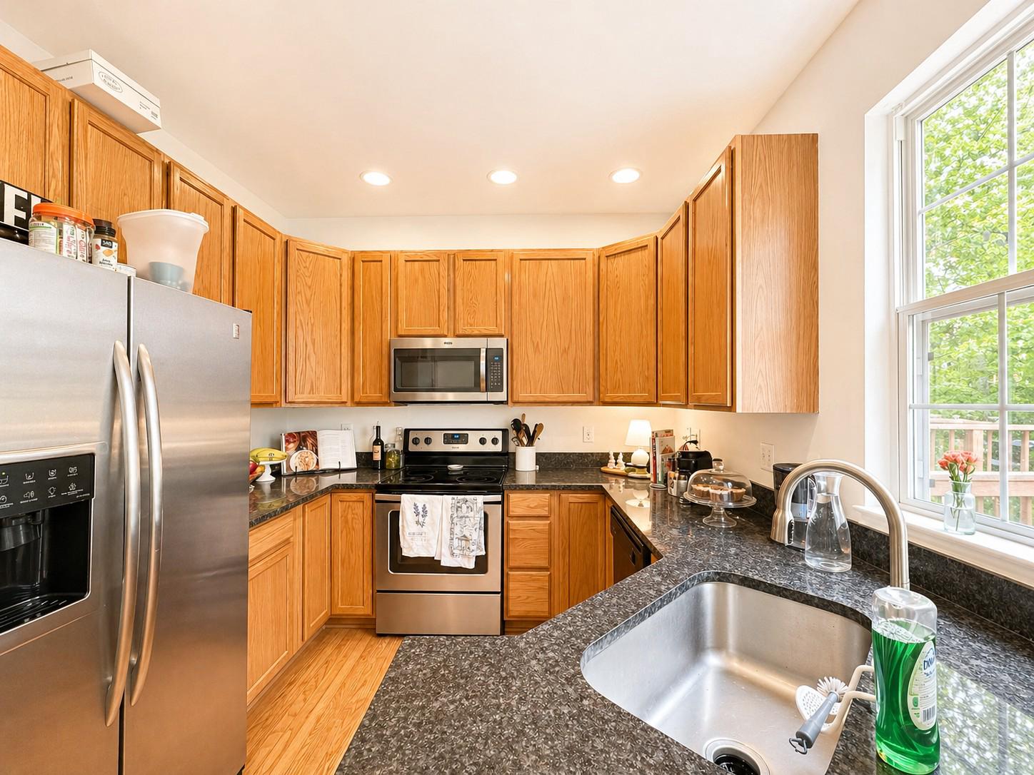 1267 Wild Hawthorn Way Reston, VA 20194 - Photo 9 of 22 kitchen with warm wood tones.
