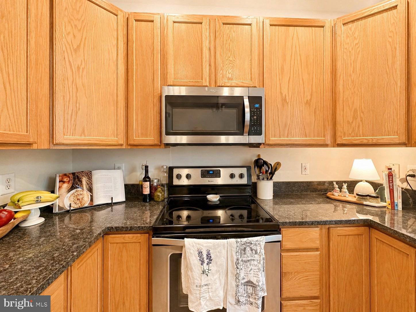1267 Wild Hawthorn Way Reston, VA 20194 - Photo 10 of 22 Warm wood tones in a cozy kitchen.