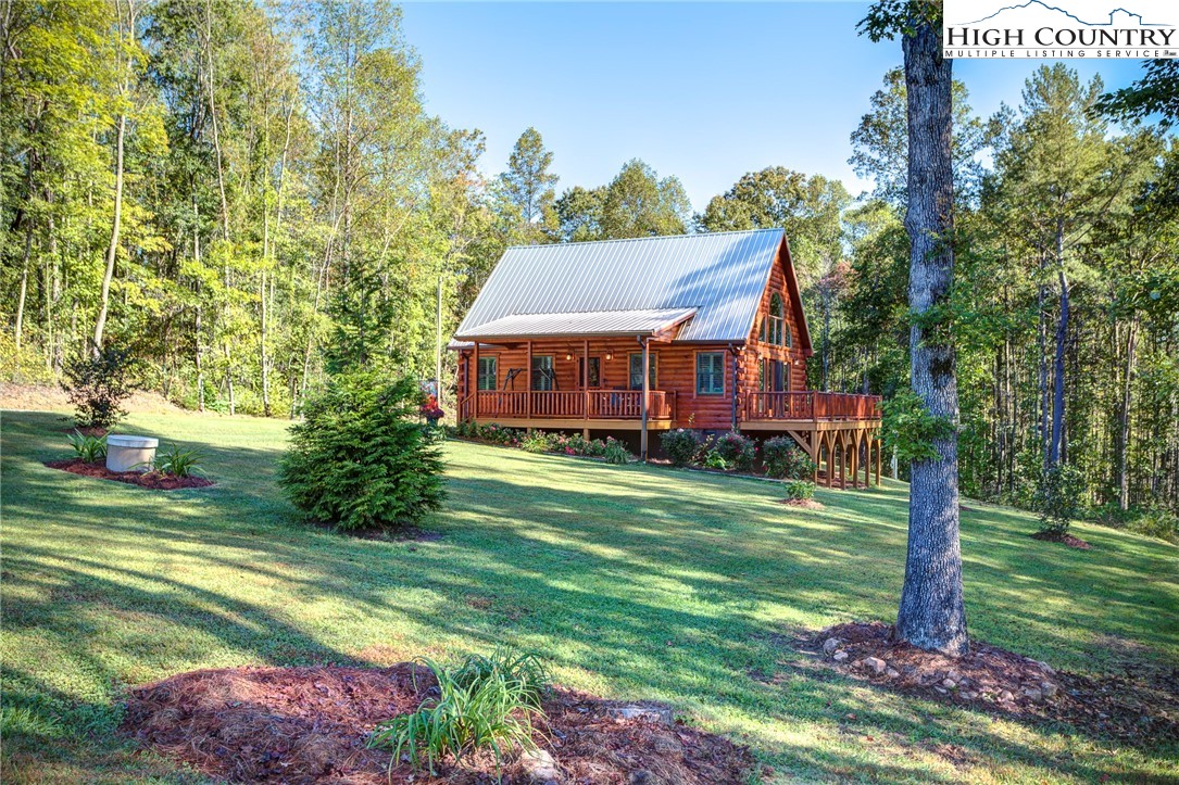 3460 South Center Church Road Thurmond, NC 28683 - Photo 6 of 50 a front view of a house with a garden