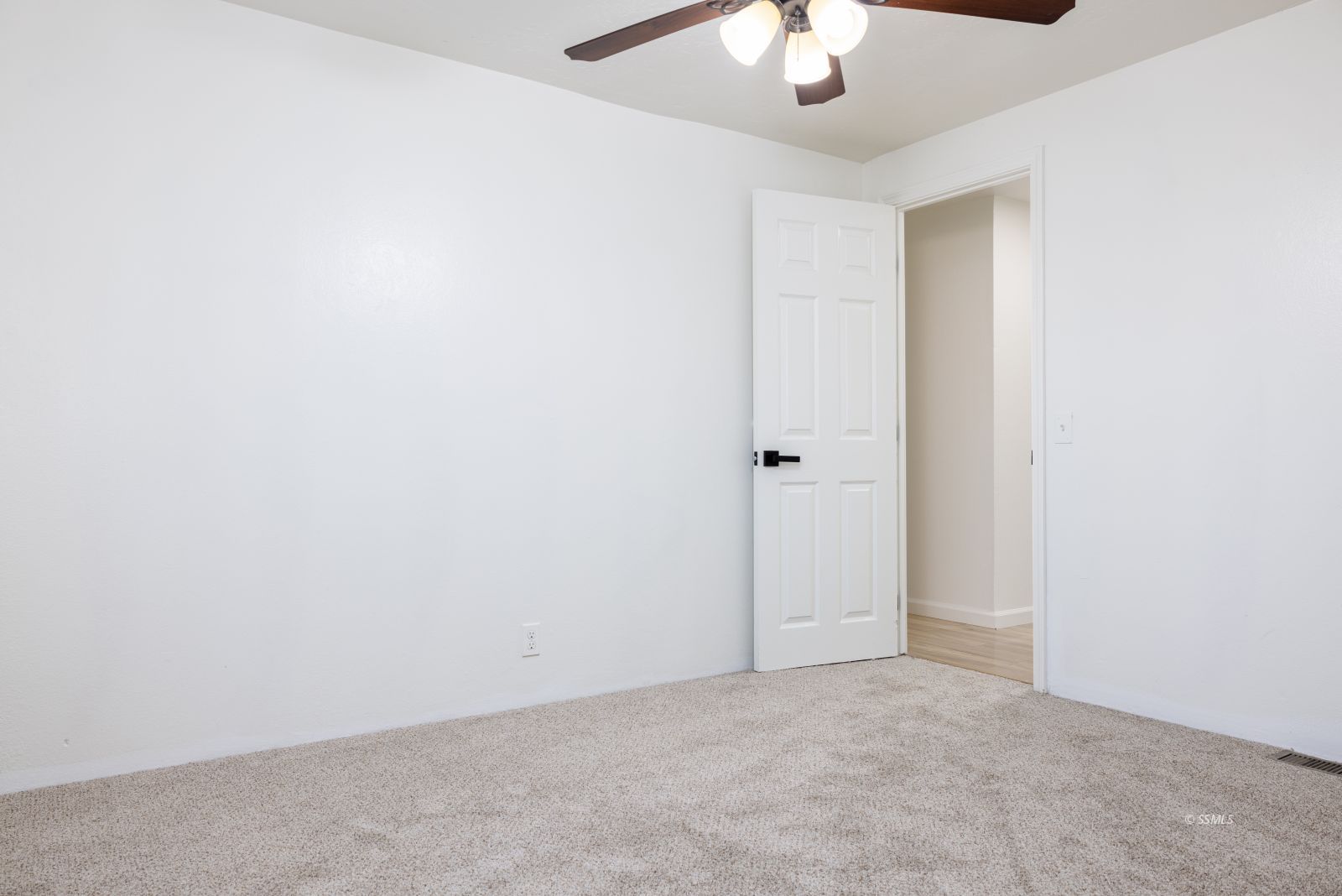 828 North Victor Street Ridgecrest, CA 93555 - Photo 24 of 50 an empty room with a chandelier fan
