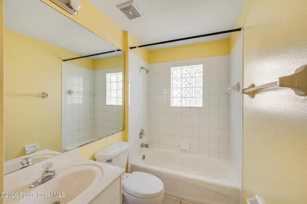 a bathroom with a toilet a sink and a bathtub