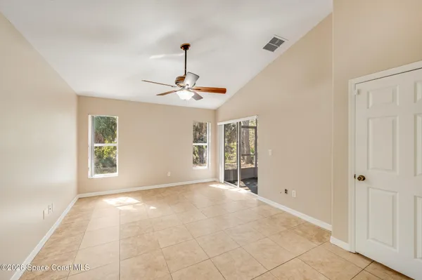 a view of an empty room with a window
