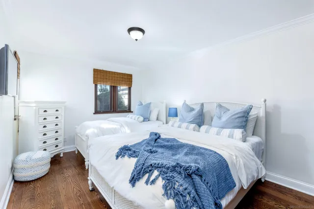 a bed room with a bed and a window