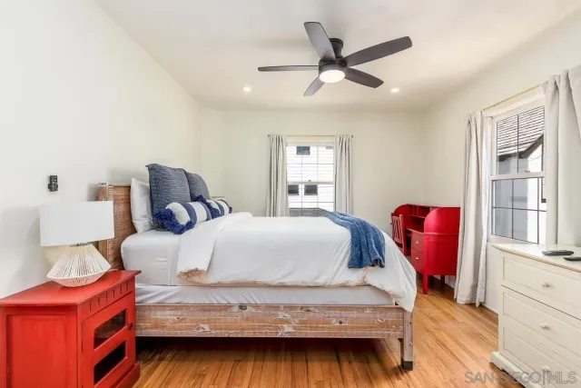 a bedroom with bed and window