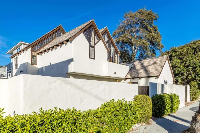 a view of a house with a snow in the background