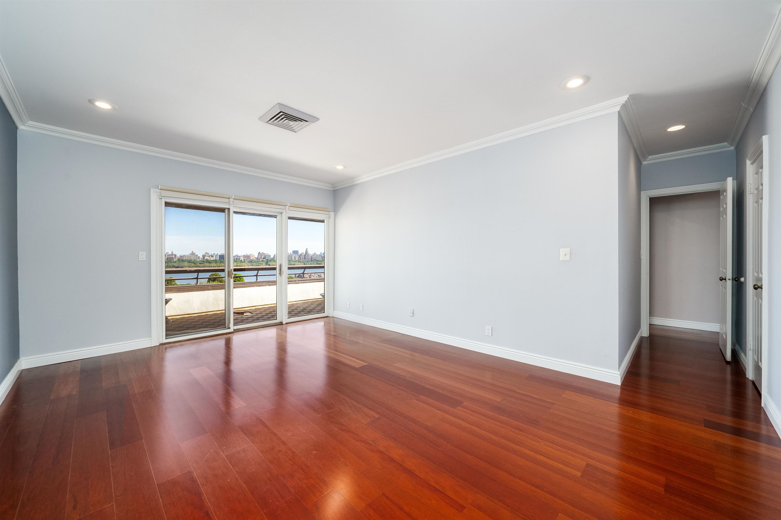 300 Gorge Road, Unit 59 Cliffside Park, NJ 07010 - Photo 4 of 14 a view of an empty room with wooden floor