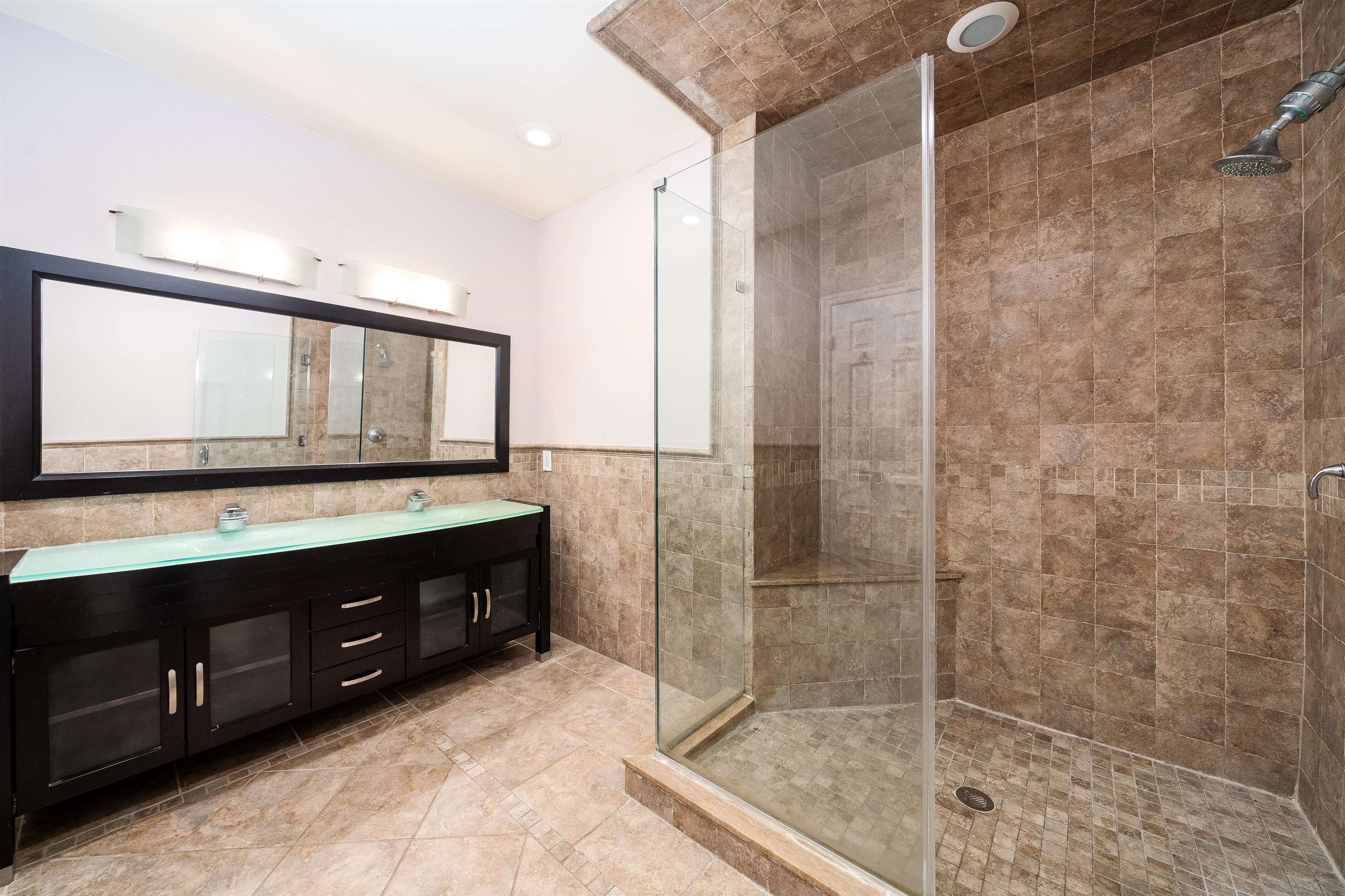 300 Gorge Road, Unit 59 Cliffside Park, NJ 07010 - Photo 5 of 14 a bathroom with a double vanity sink mirror and shower