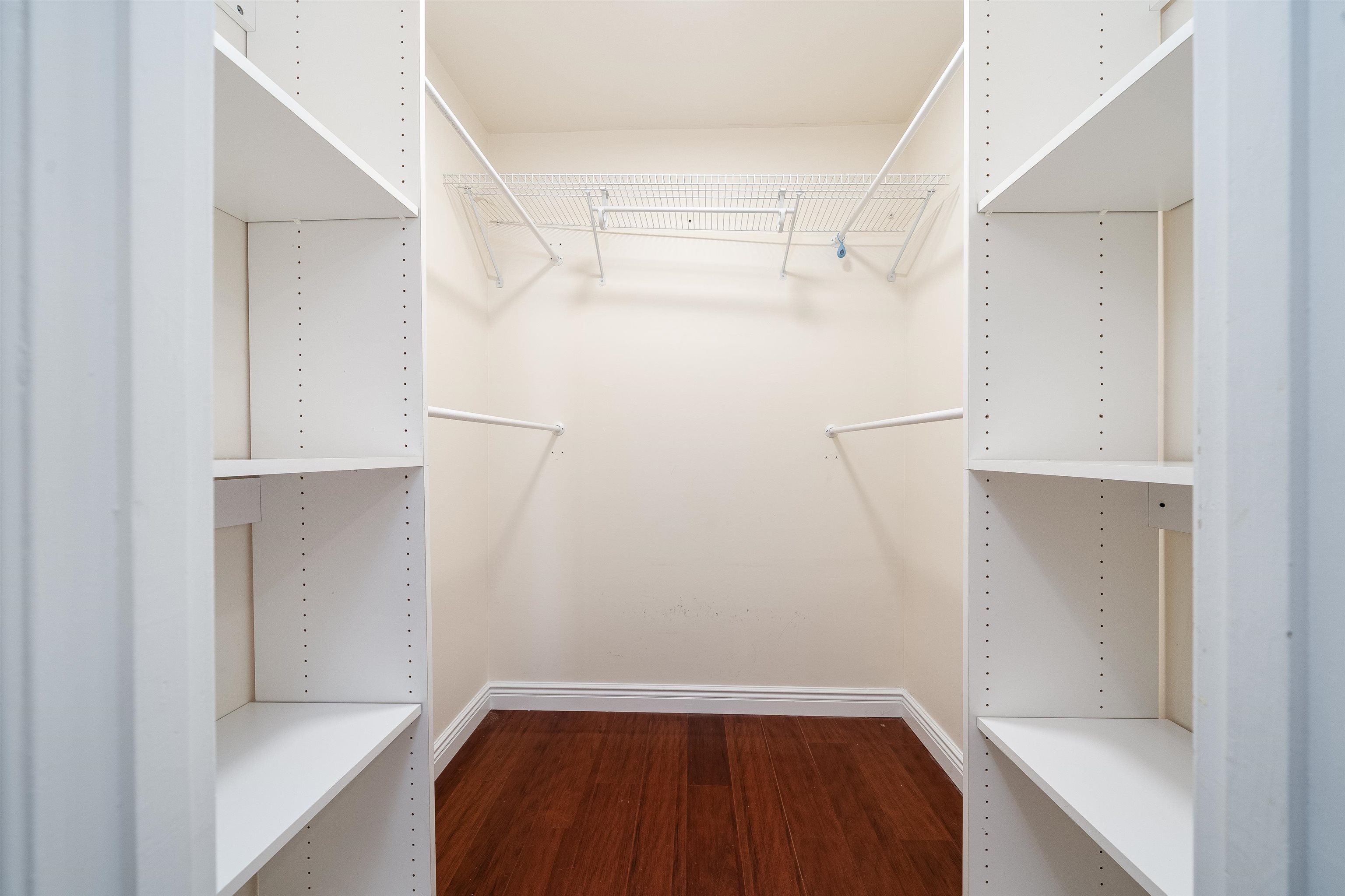 300 Gorge Road, Unit 59 Cliffside Park, NJ 07010 - Photo 6 of 14 a view of walk in closet with wooden floor