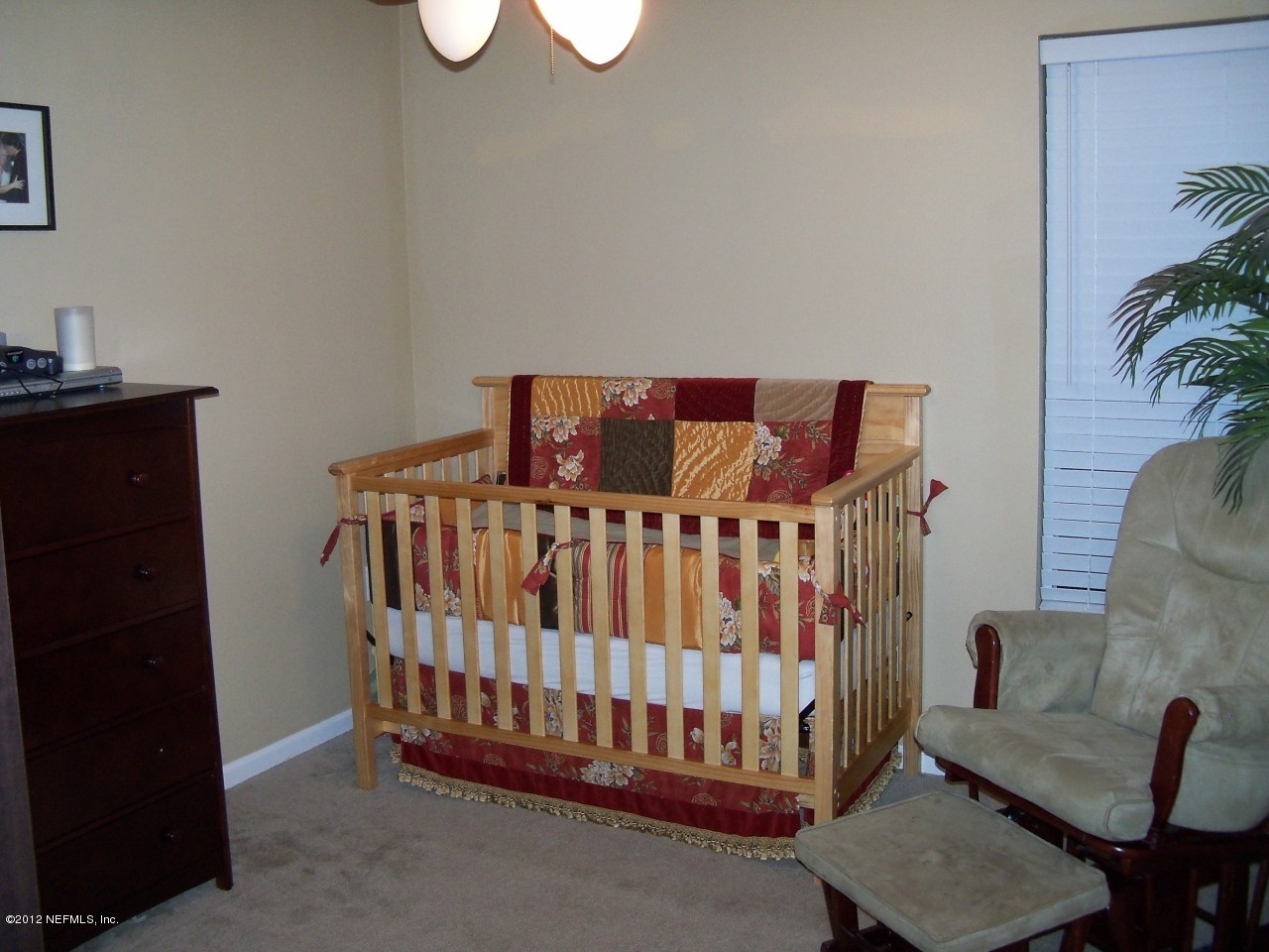 9135 Raptor Drive Jacksonville, FL 32221 - Photo 14 of 15 a bedroom with furniture and a window
