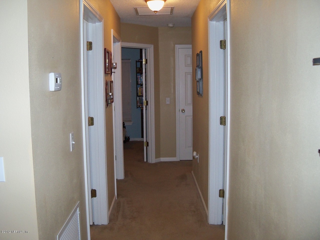 9135 Raptor Drive Jacksonville, FL 32221 - Photo 8 of 15 a view of a hallway with wooden floor