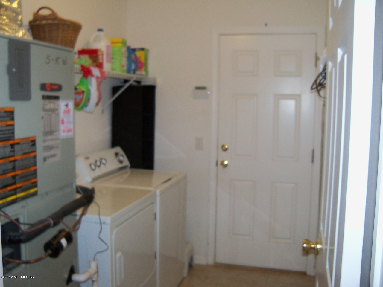 9135 Raptor Drive Jacksonville, FL 32221 - Photo 9 of 15 a room with a refrigerator and washer