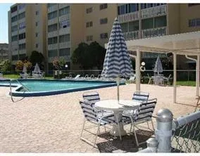 a patio with table and chairs