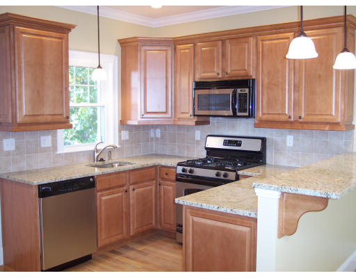 23 Robbins Street, Unit 31 Waltham, MA 02453 - Photo 1 of 1 a kitchen with cabinets a window and a sink