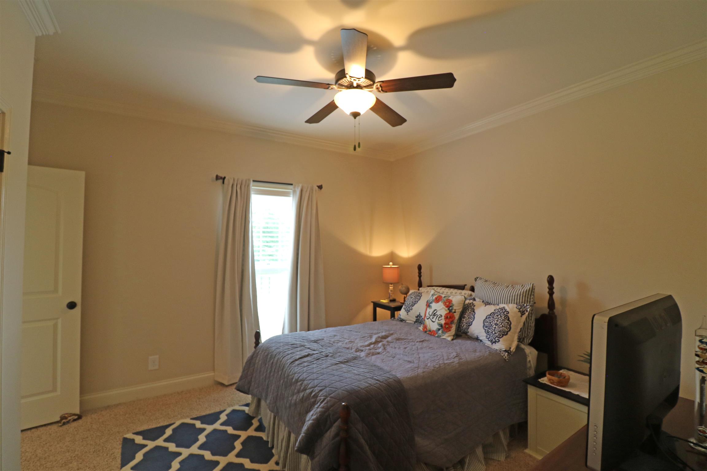 1235 Mires Road Mount Juliet, TN 37122 - Photo 19 of 30 Bedroom #2 12 x 12 located on the main level on the opposite side of the house from the Owner’s suite, offering crown molding, faux wood blinds, ceiling fan w/ light, two large closets and a private full bathroom.