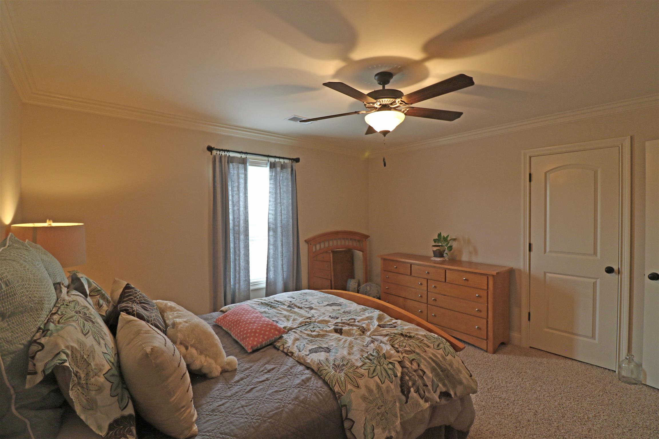 1235 Mires Road Mount Juliet, TN 37122 - Photo 22 of 30 Bedroom #4 13 x 12 located on the back side of the house on the second level, this room offers a large closet, crown molding, ceiling fan/light, and access to the walk-in attic storage area.