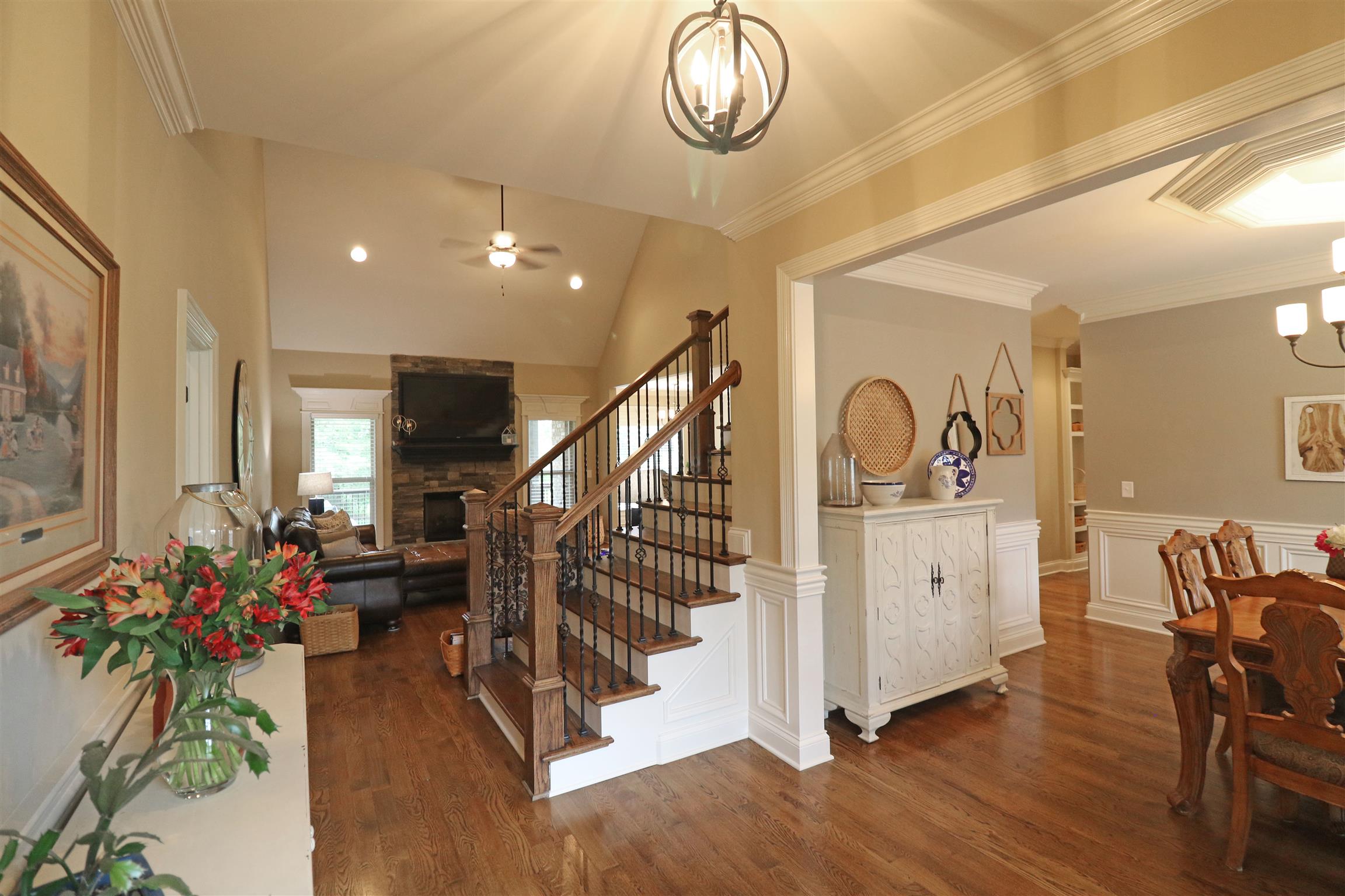 1235 Mires Road Mount Juliet, TN 37122 - Photo 4 of 30 Inviting entry foyer with hardwood flooring, crown molding, wainscoting, and a solid wood double entry door with stained wood blinds.