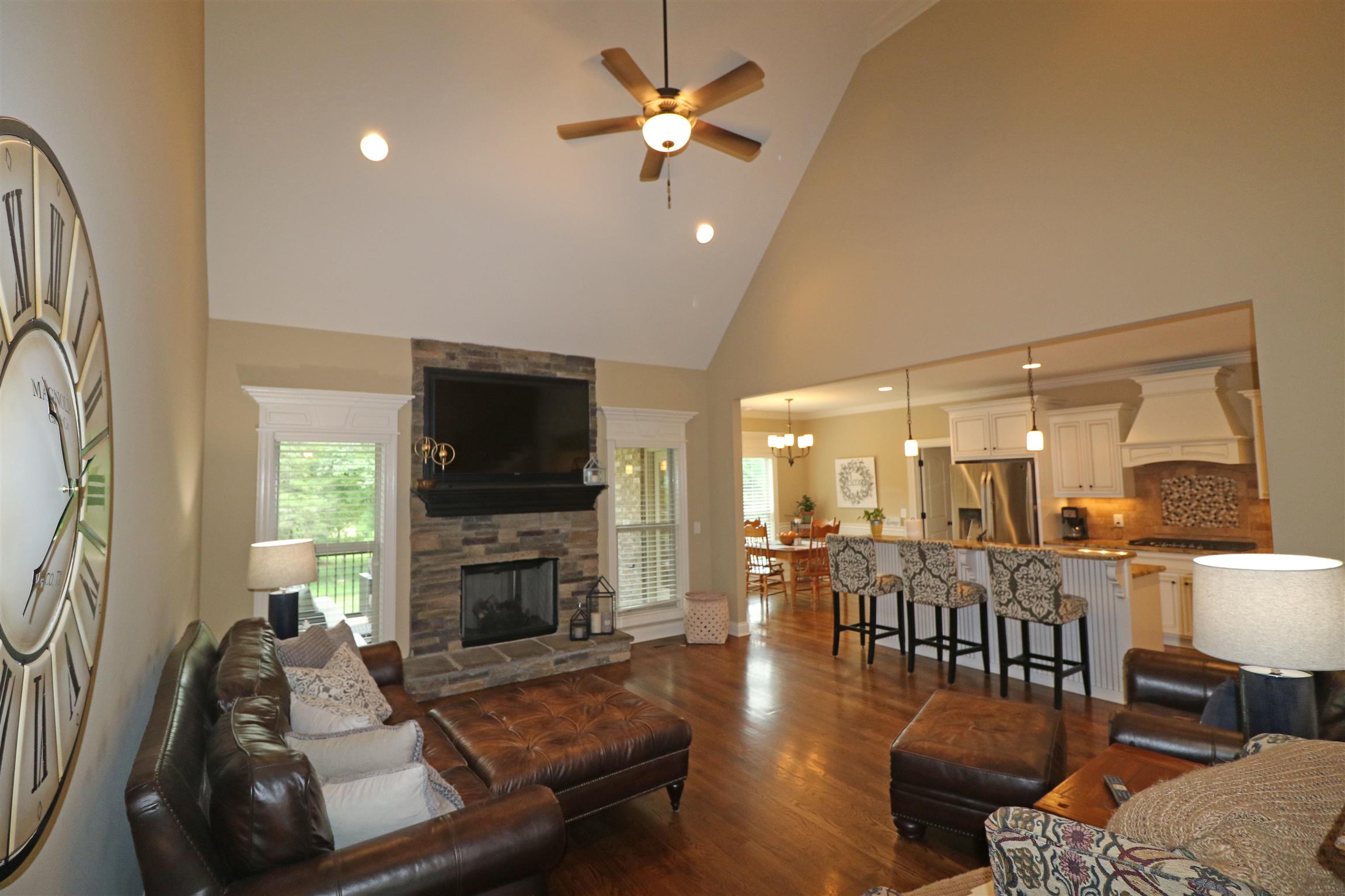1235 Mires Road Mount Juliet, TN 37122 - Photo 7 of 30 Living Room: 18 x 15 This room features a pitched ceiling with a stacked stone gas log fireplace with raised hearth, hardwood flooring, faux wood blinds, recessed lighting, ceiling fan with light & remote, and an open design into the Kitchen & Foyer