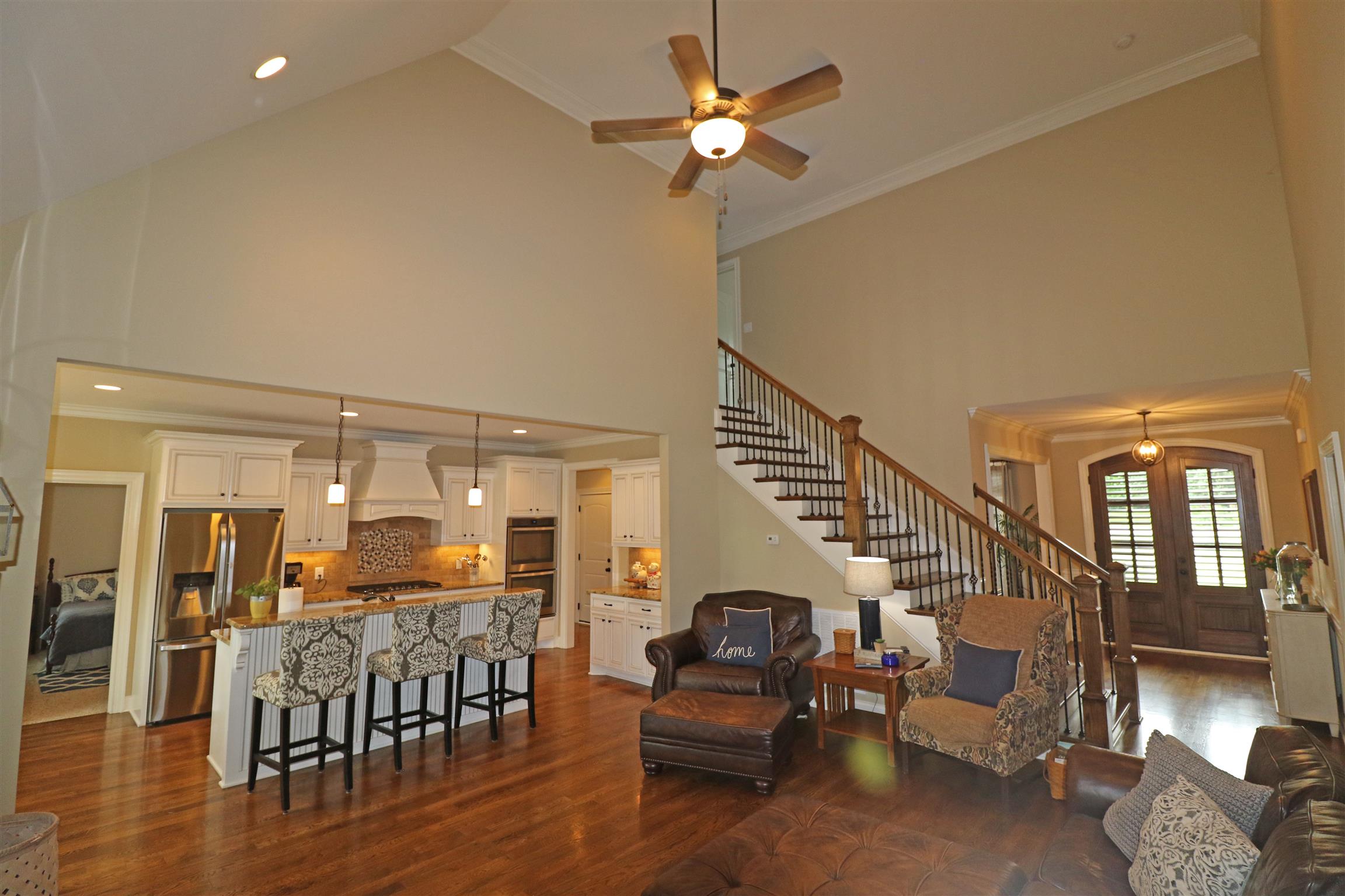 1235 Mires Road Mount Juliet, TN 37122 - Photo 8 of 30 This room features a pitched ceiling with a stacked stone gas log fireplace with raised hearth, hardwood flooring, faux wood blinds, recessed lighting, ceiling fan with light & remote, and an open design into the Kitchen & Foyer