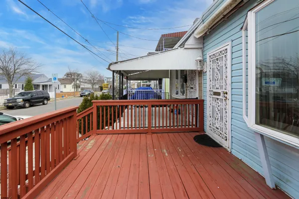 a view of a balcony with wooden floor