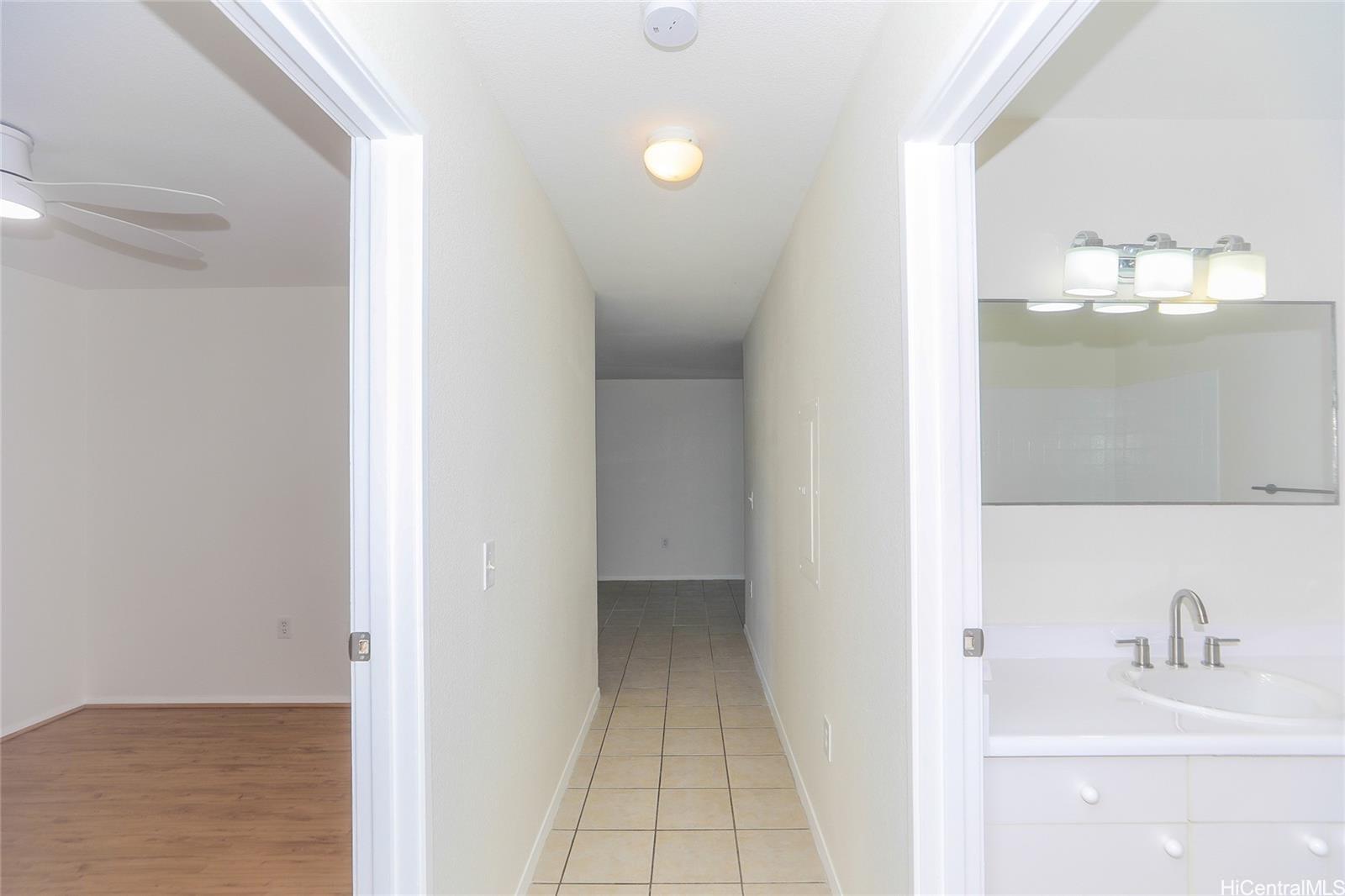 91-1101 Namahoe Street, Unit 3H Kapolei, HI 96707 - Photo 13 of 25 a bathroom with a sink and a mirror