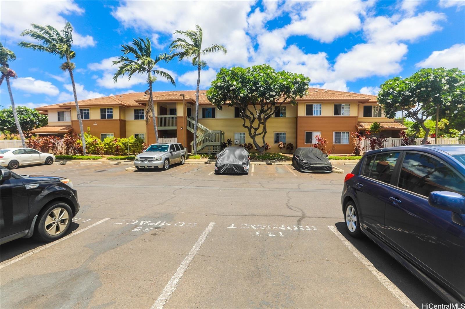 91-1101 Namahoe Street, Unit 3H Kapolei, HI 96707 - Photo 16 of 25 a car parked in front of a building