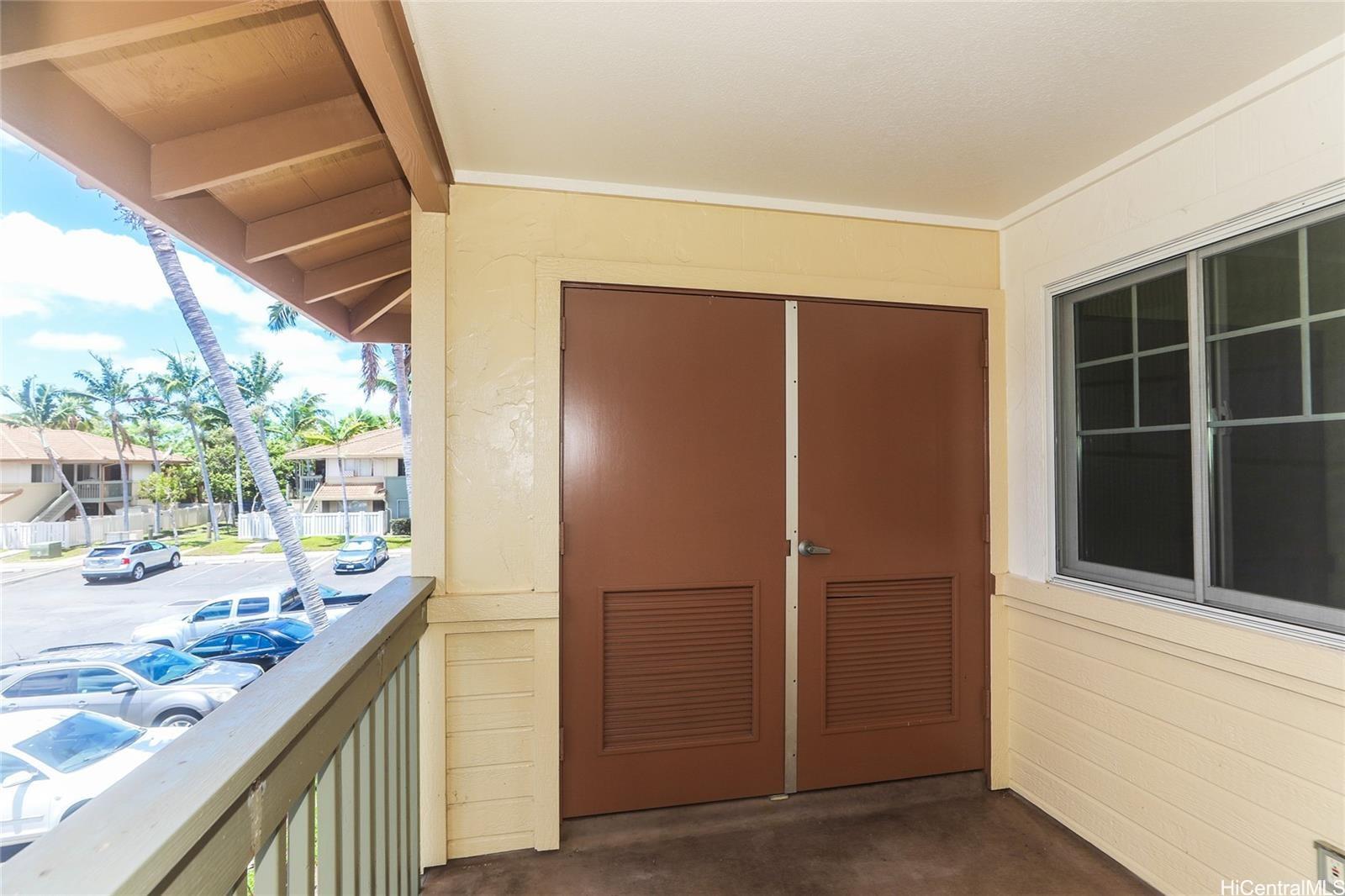 91-1101 Namahoe Street, Unit 3H Kapolei, HI 96707 - Photo 18 of 25 a kitchen with stainless steel appliances granite countertop a refrigerator and a sink