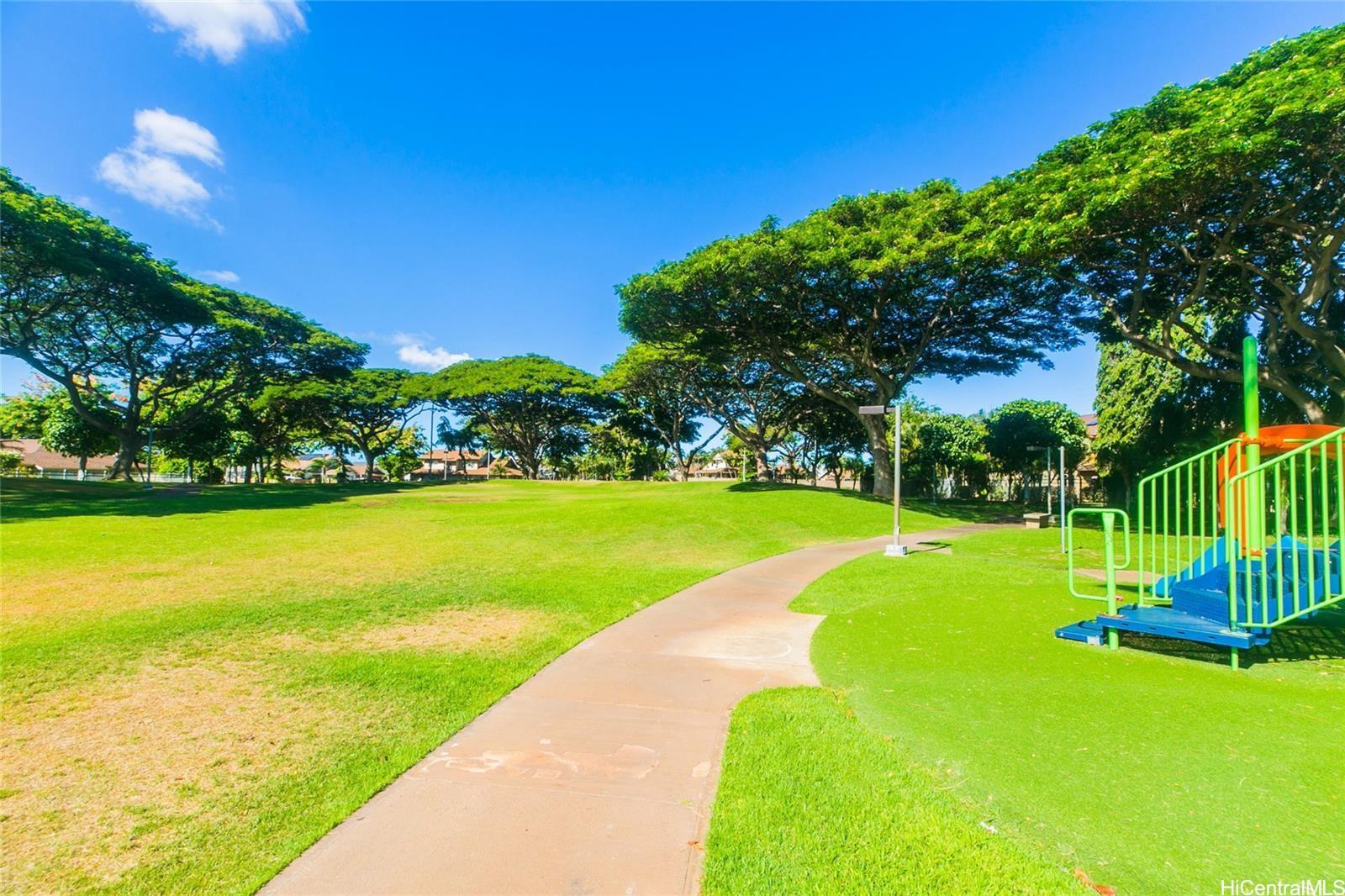 91-1101 Namahoe Street, Unit 3H Kapolei, HI 96707 - Photo 23 of 25 a view of a park with large trees