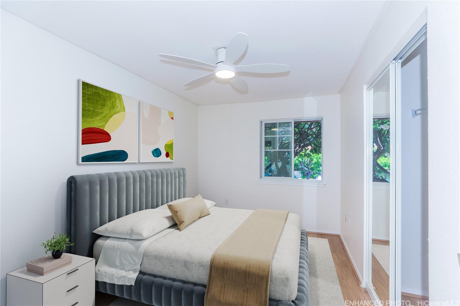 91-1101 Namahoe Street, Unit 3H Kapolei, HI 96707 - Photo 10 of 25 a bedroom with a bed and a window