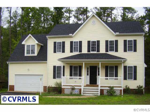 9436 Dunroming Road Chesterfield, VA 23832 - Photo 1 of 9 a front view of a house with garden