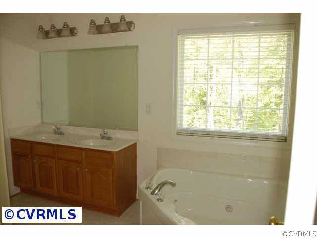 9436 Dunroming Road Chesterfield, VA 23832 - Photo 7 of 9 a view of bathroom with dual sinks
