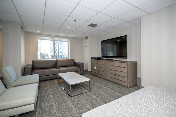 a work room with furniture and a wooden floor