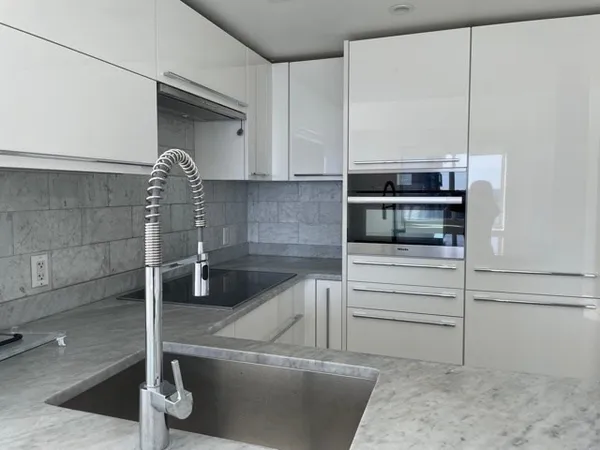 a kitchen with a sink and cabinets