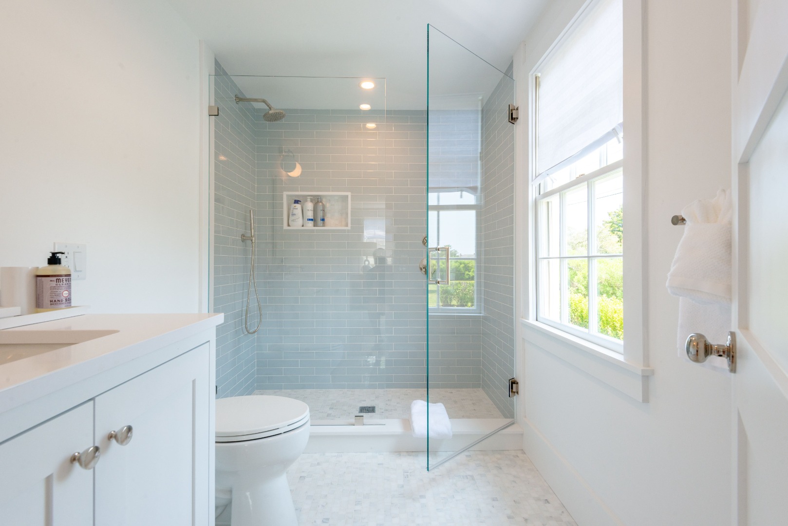 12 Willard Street Nantucket, MA 02554 - Photo 17 of 36 a bathroom with a granite countertop sink a toilet and shower
