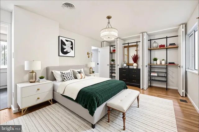 a bedroom with a large bed and a couch