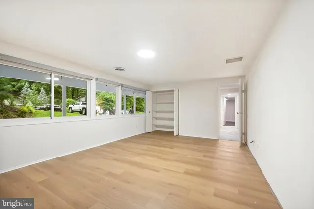 a bathroom with a sink a mirror and a shower