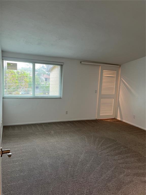 686 White Pine Tree Road, Unit 64 Venice, FL 34285 - Photo 15 of 20 an empty room with a window