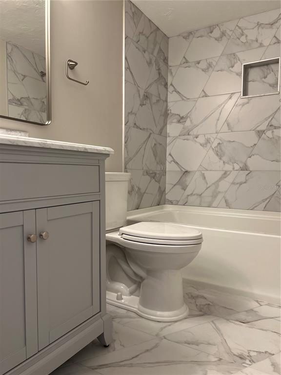686 White Pine Tree Road, Unit 64 Venice, FL 34285 - Photo 20 of 20 a bathroom with a toilet and a shower