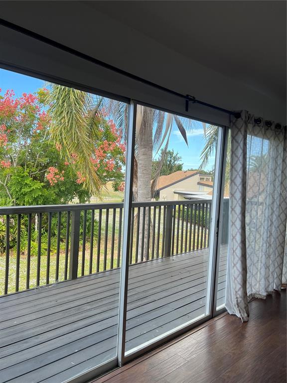 686 White Pine Tree Road, Unit 64 Venice, FL 34285 - Photo 7 of 20 a view of a balcony with wooden floor
