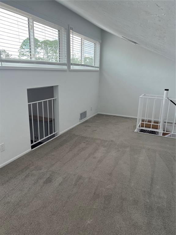 686 White Pine Tree Road, Unit 64 Venice, FL 34285 - Photo 9 of 20 an empty room with a window