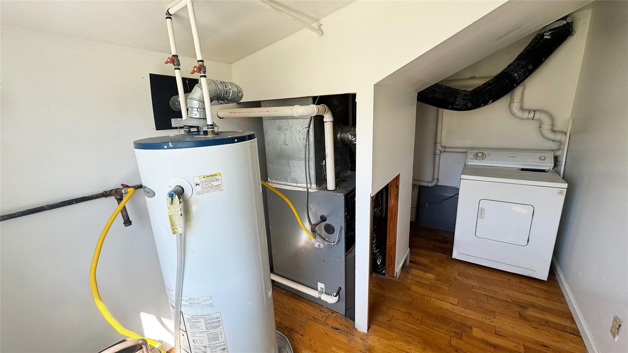 892 Bowbell Road Greene, NY 13778 - Photo 21 of 35 Utilities featuring washer / clothes dryer, gas water heater, and heating unit