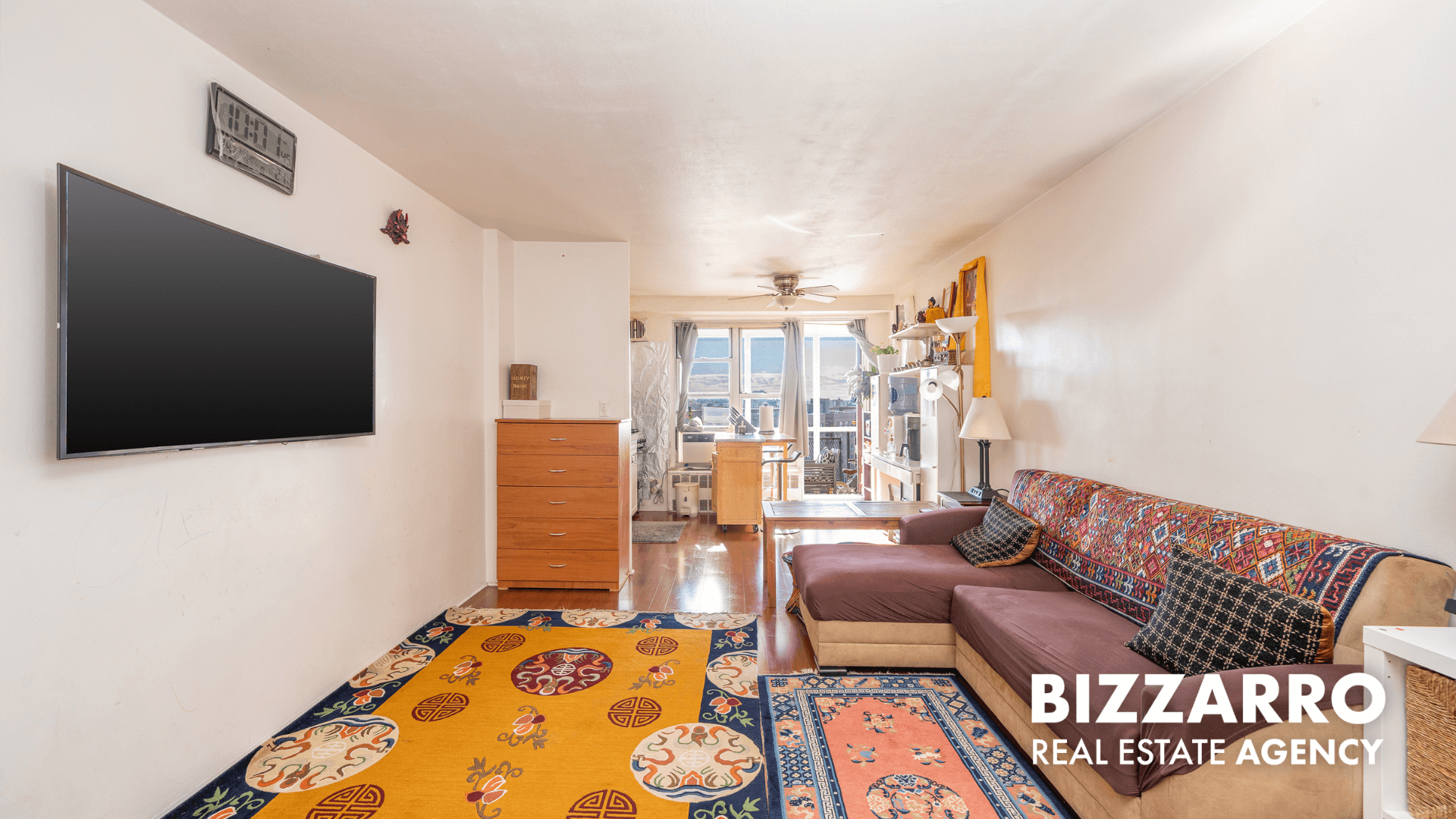 35-11 85th Street, Unit 9A Queens, NY 11372 - Photo 1 of 21 a living room with furniture and a flat screen tv