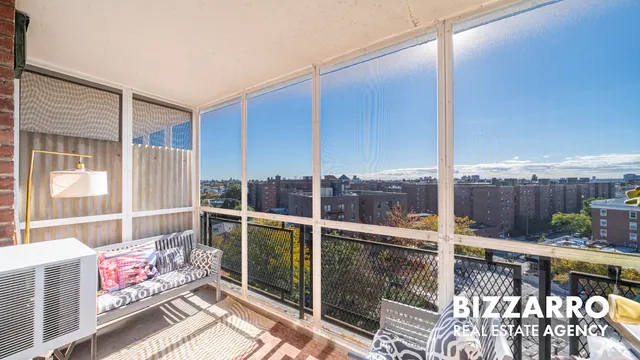 a view of roof deck with furniture