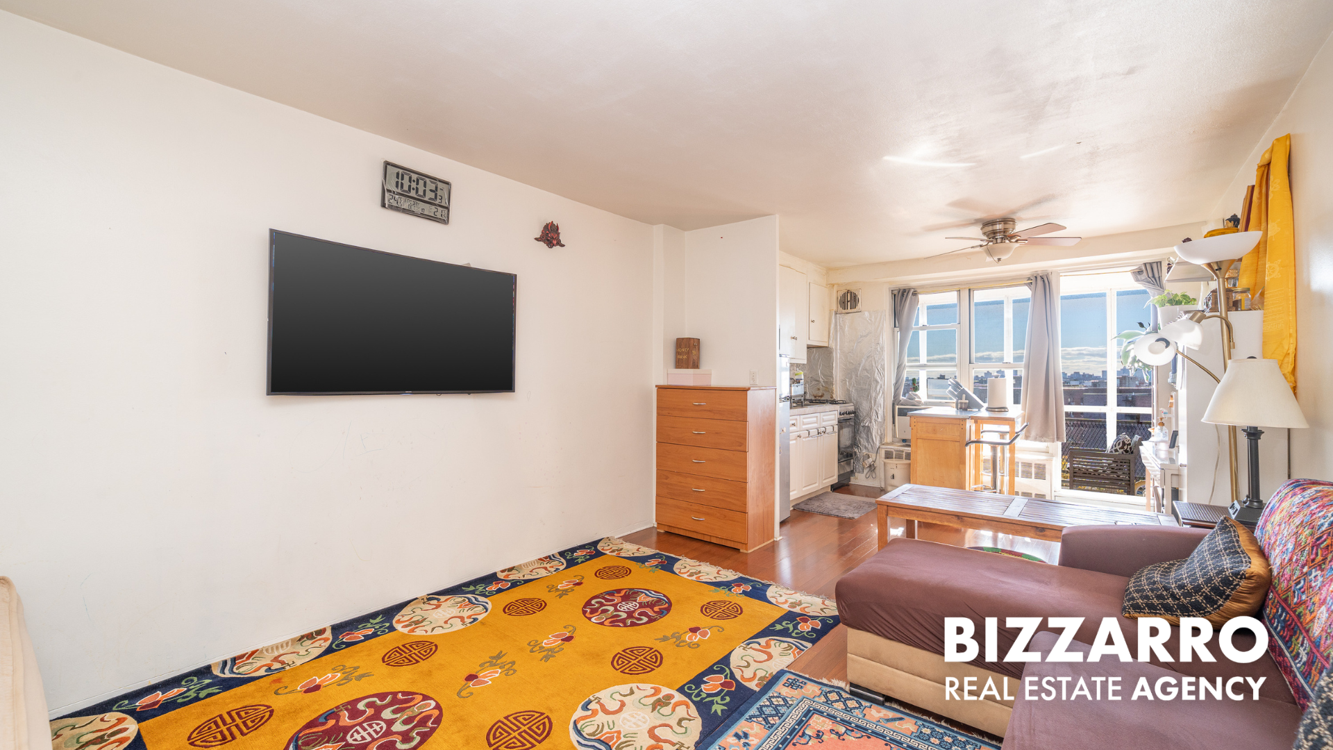 35-11 85th Street, Unit 9A Queens, NY 11372 - Photo 3 of 21 a bedroom with a bed and a television