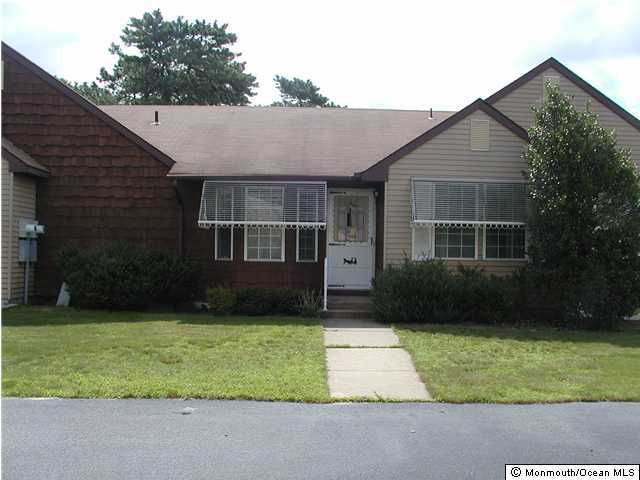 a view of a yard in front view of a house