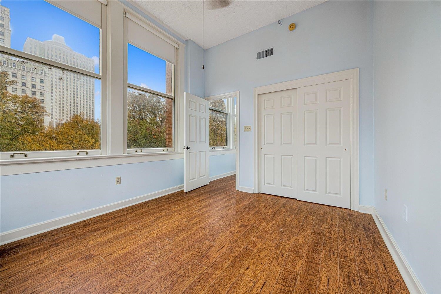 10 North Main Street, Unit 301 Memphis, TN 38103 - Photo 9 of 31 a view of empty room with wooden floor and fan