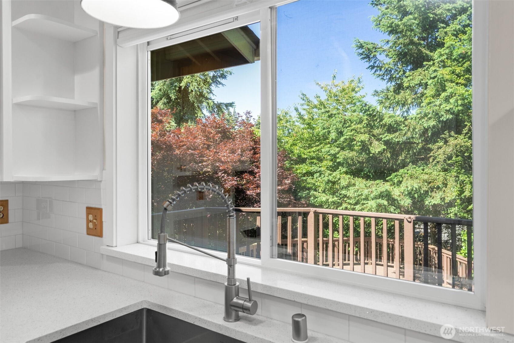 26227 Montera Loop Northeast Kingston, WA 98346 - Photo 8 of 22 a view of a balcony with a tree